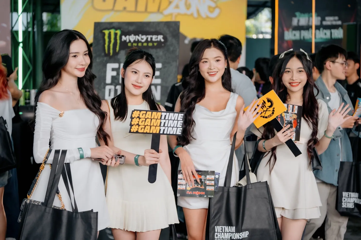 GAM fans holding #GAMTIME signs at the GAM fan zone at a Vietnam Championship Series event