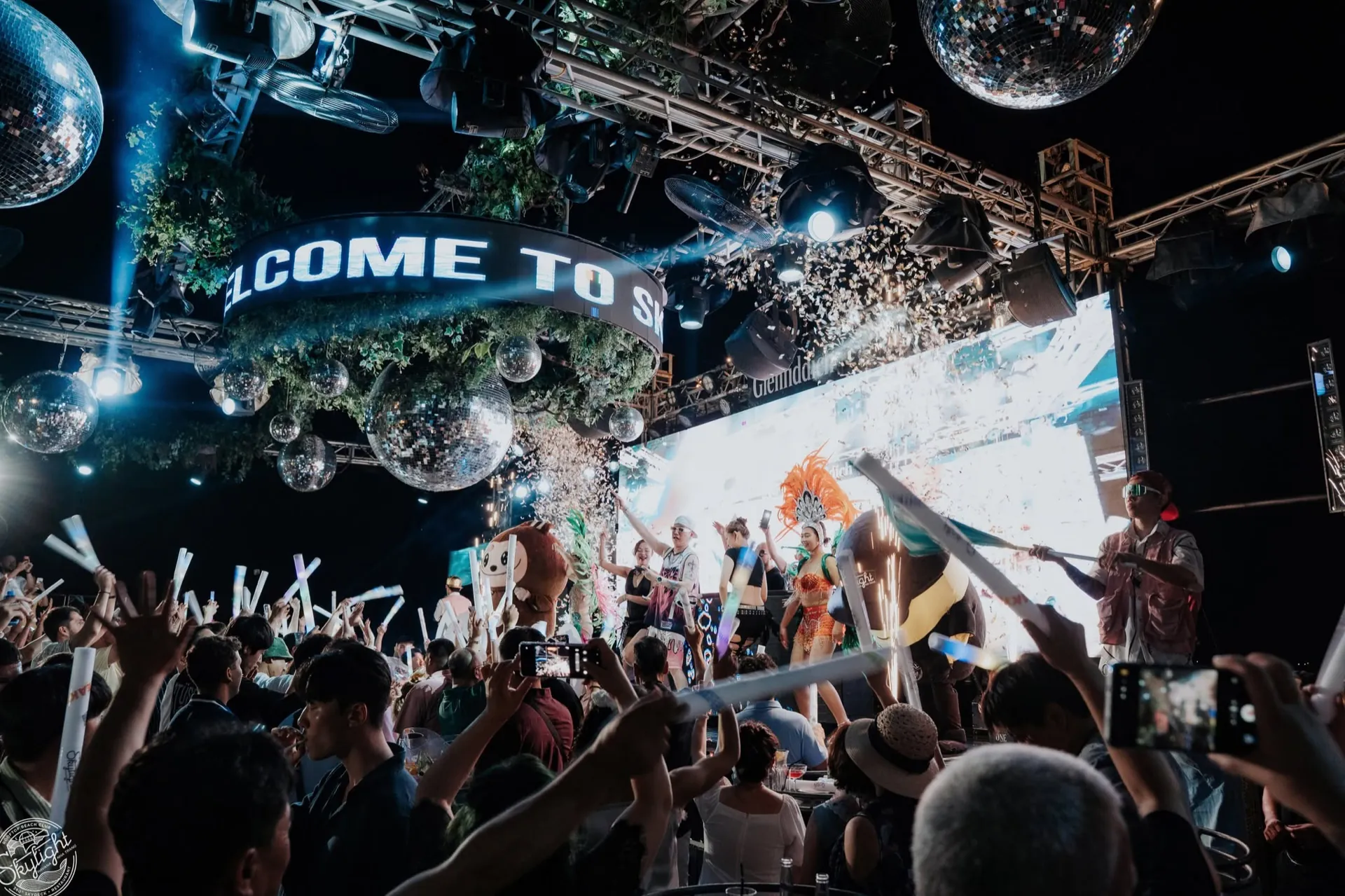 A packed Skylight dance floor, confetti and performers on stage under the disco balls
