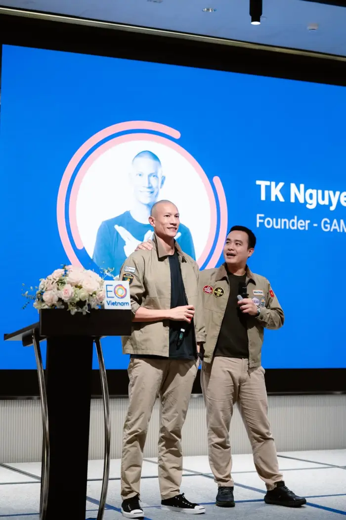 TK Nguyen on stage at an EO Vietnam event