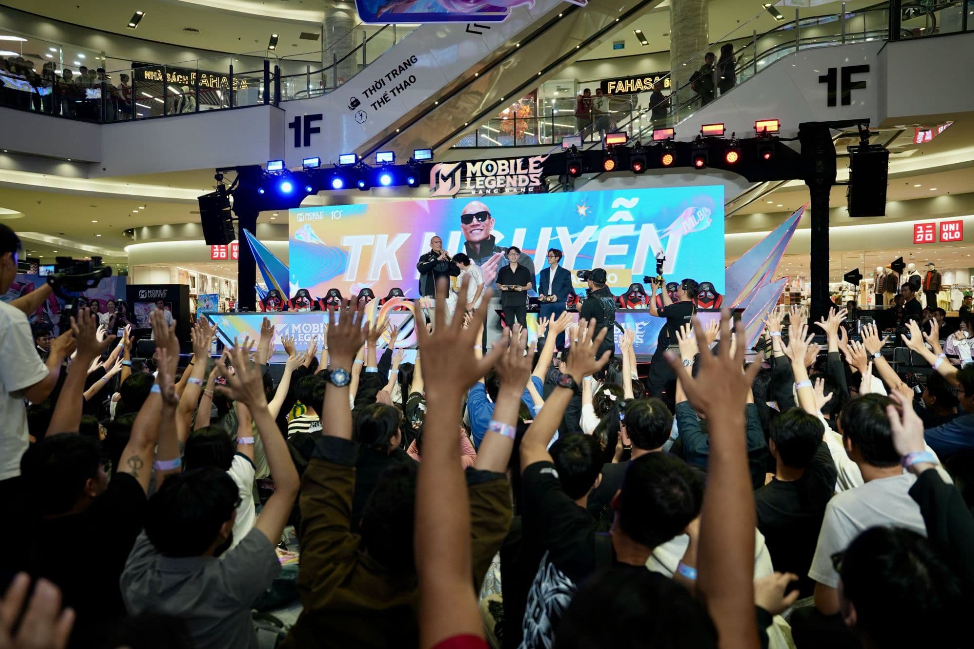 Mobile Legends: Bang Bang: On stage at an MLBB fan event, the crowd’s hands up · Vietnam