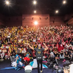 A packed cinema of GAM fans and cosplayers at a GAM Esports viewing party
